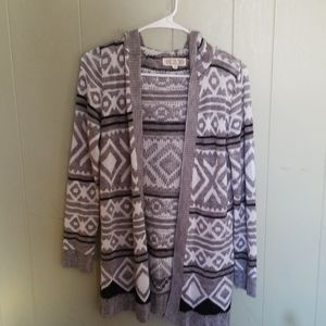 Sweater fits more like a small to med